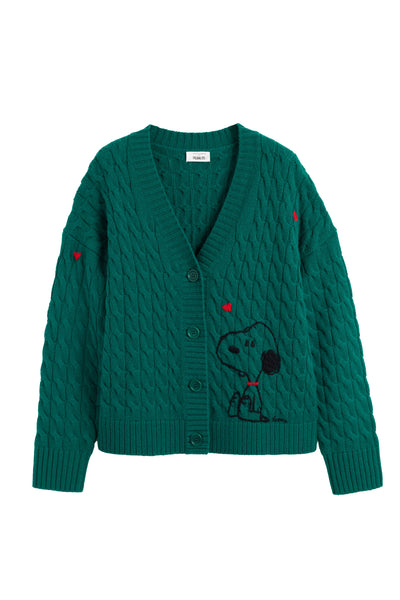 Green cable knit cardigan with a dog design on a white background
