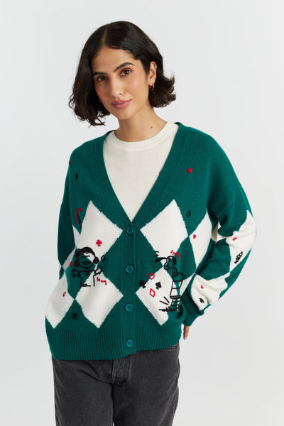 Woman wearing a green and white patterned cardigan on a white background