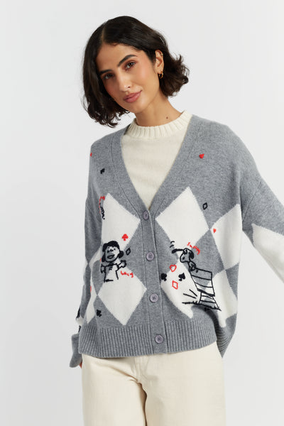 Woman wearing a gray cardigan with cartoon character design on a white background