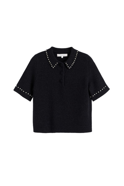 Black blouse with studded details on a white background