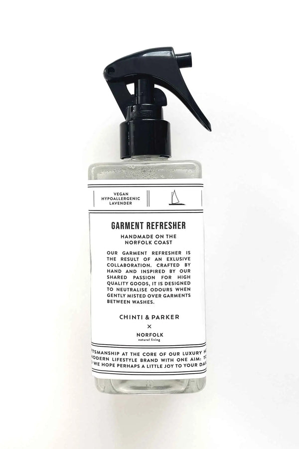 Garment refresher bottle with a label on a white background