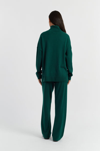 Person wearing a green outfit on a white background