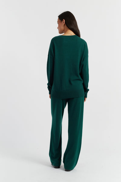 Woman wearing a green outfit on a white background