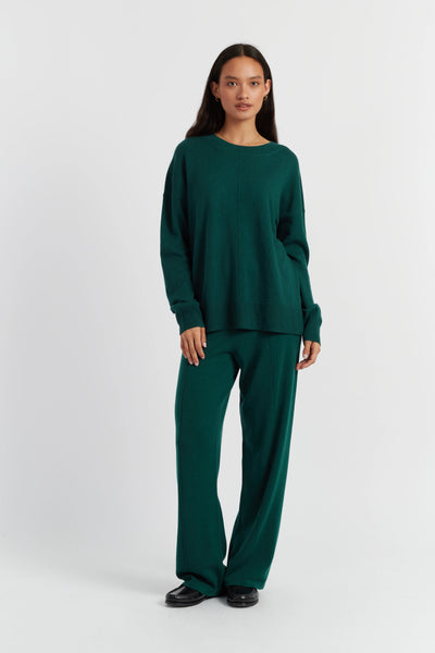 Woman wearing a green outfit on a white background