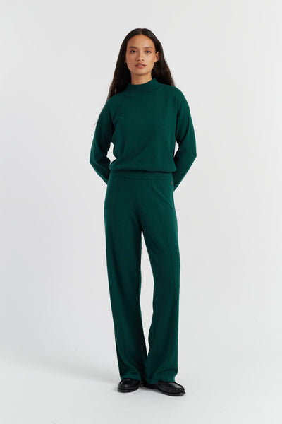 Person wearing a green outfit on a white background