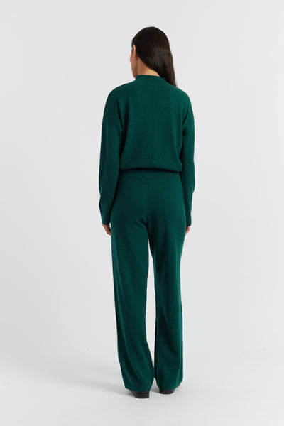 Person wearing a green outfit on a white background