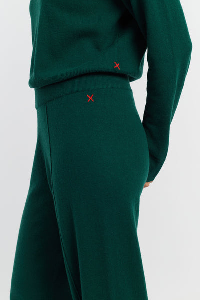 Green outfit with red 'X' markers on a white background