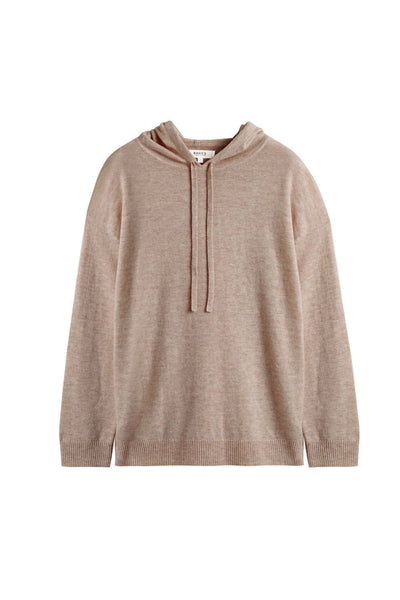 Woman wearing a beige hoodie on a white background