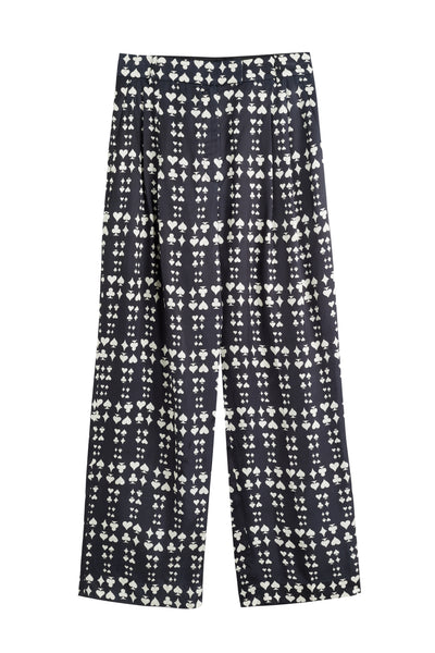 Black pants with white geometric pattern on a white background