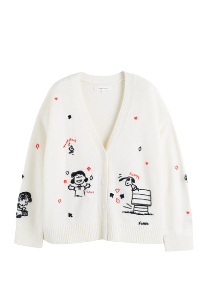 White cardigan with black illustrations and red hearts on a white background