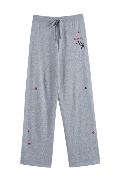 Gray pajama pants with heart and star patterns on a white background