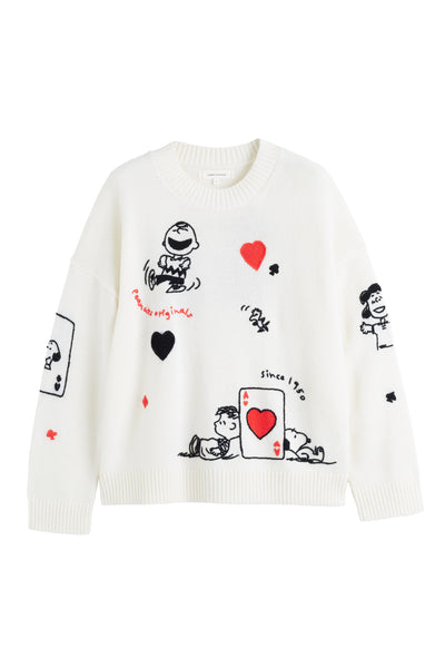 White sweater with black and red graphics on a white background