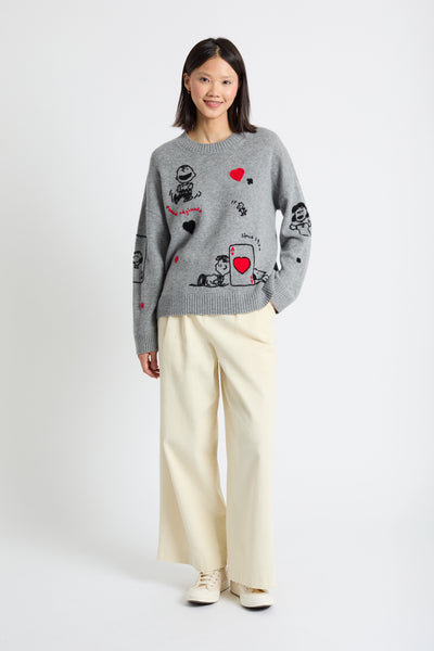 Gray sweater with cartoon character designs on a white background