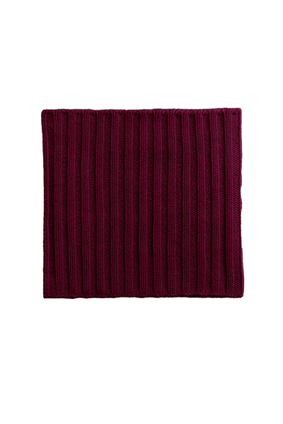 Maroon knitted scarf on a white background