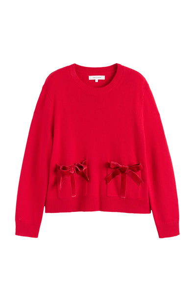 Red sweater with bow details on a white background