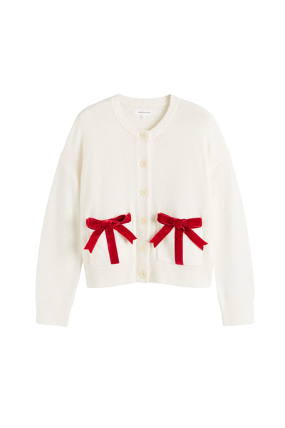White cardigan with red bows on a white background