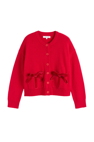 Red cardigan with bow details on a white background