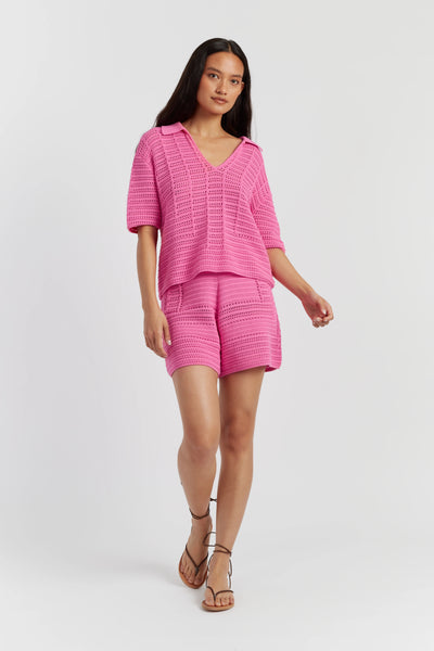 Woman wearing a pink outfit on a white background