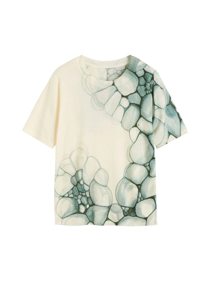 T-shirt with abstract green design on a white background