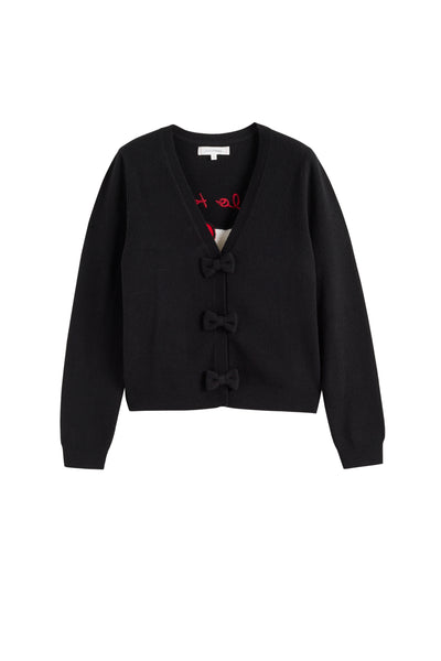 Black cardigan with bow details on a white background