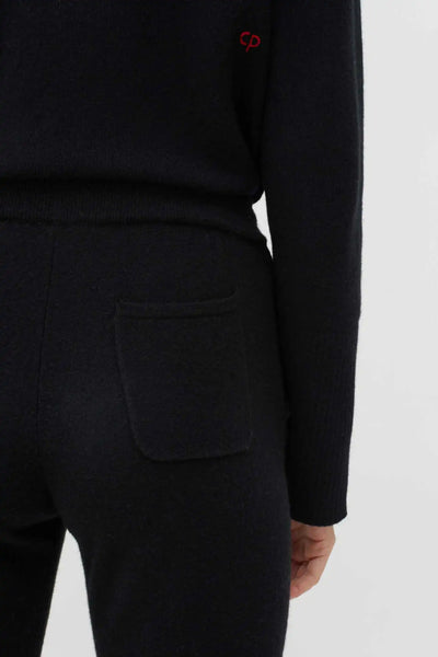 Black outfit with a pocket on a white background