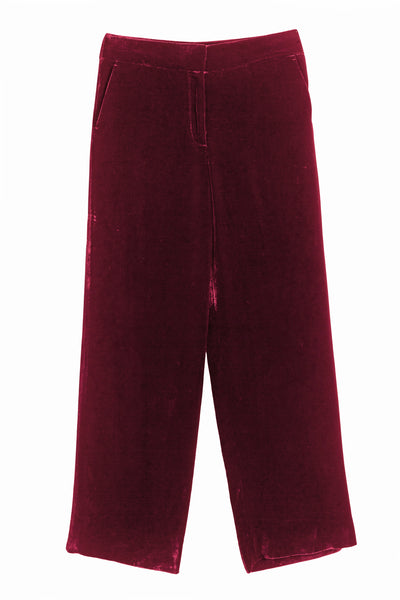 Maroon velvet pants on a white background