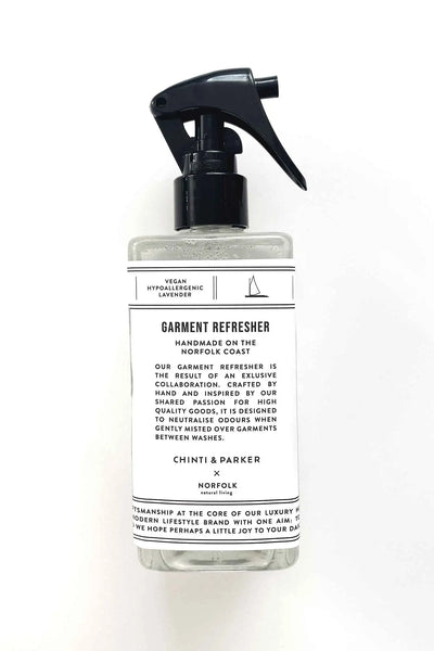 Garment refresher bottle with a label on a white background