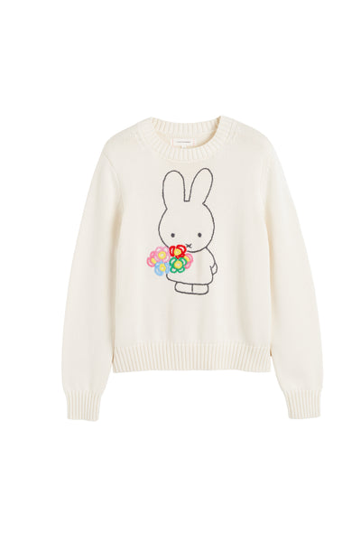White sweater with a cartoon bunny holding flowers on a white background