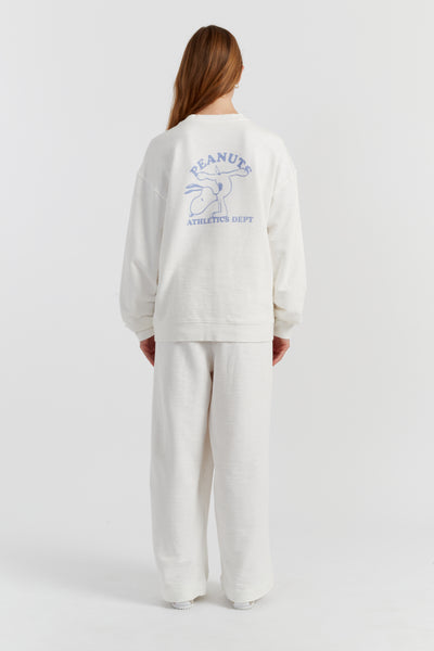 Person wearing a white sweatshirt with a logo on the back against a white background