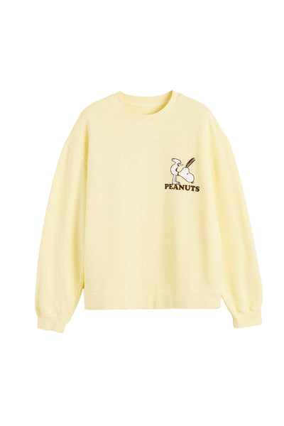 Light yellow sweatshirt with a small logo on a white background
