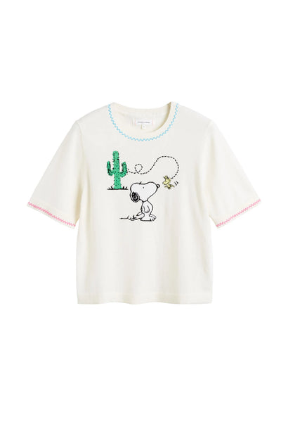 White t-shirt with cartoon character and cactus design on a white background
