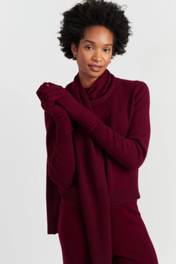 Person wearing a burgundy outfit on a white background